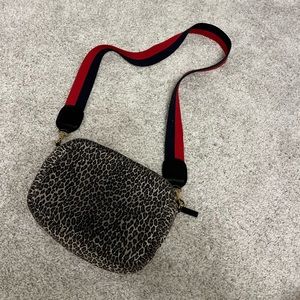 clare v. Cheetah print cross body purse.
